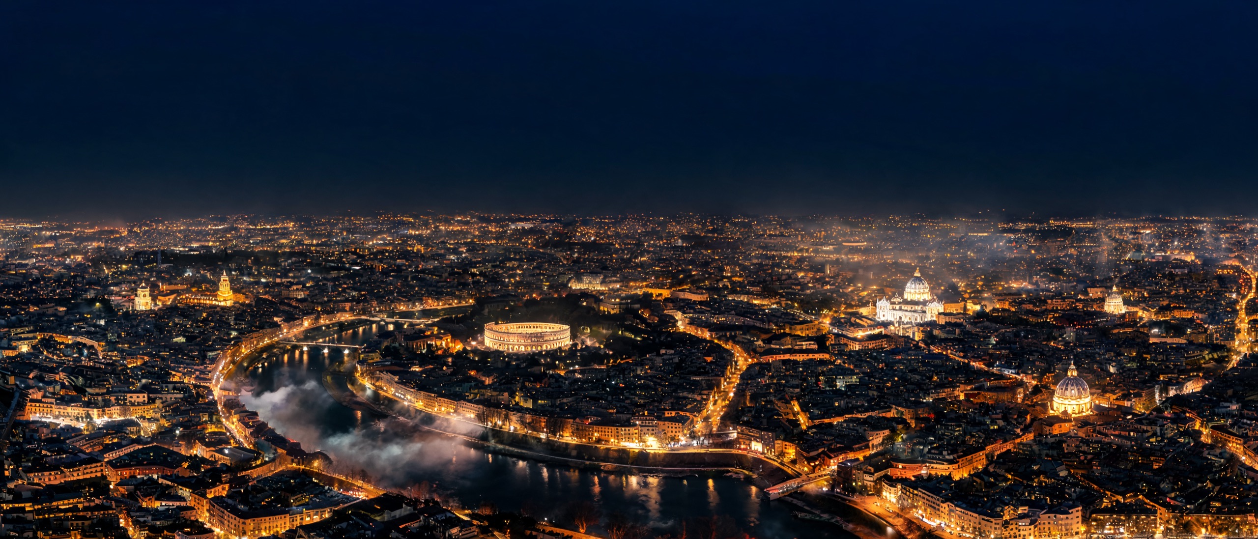 Aerial night view of Rome and the Tiber river